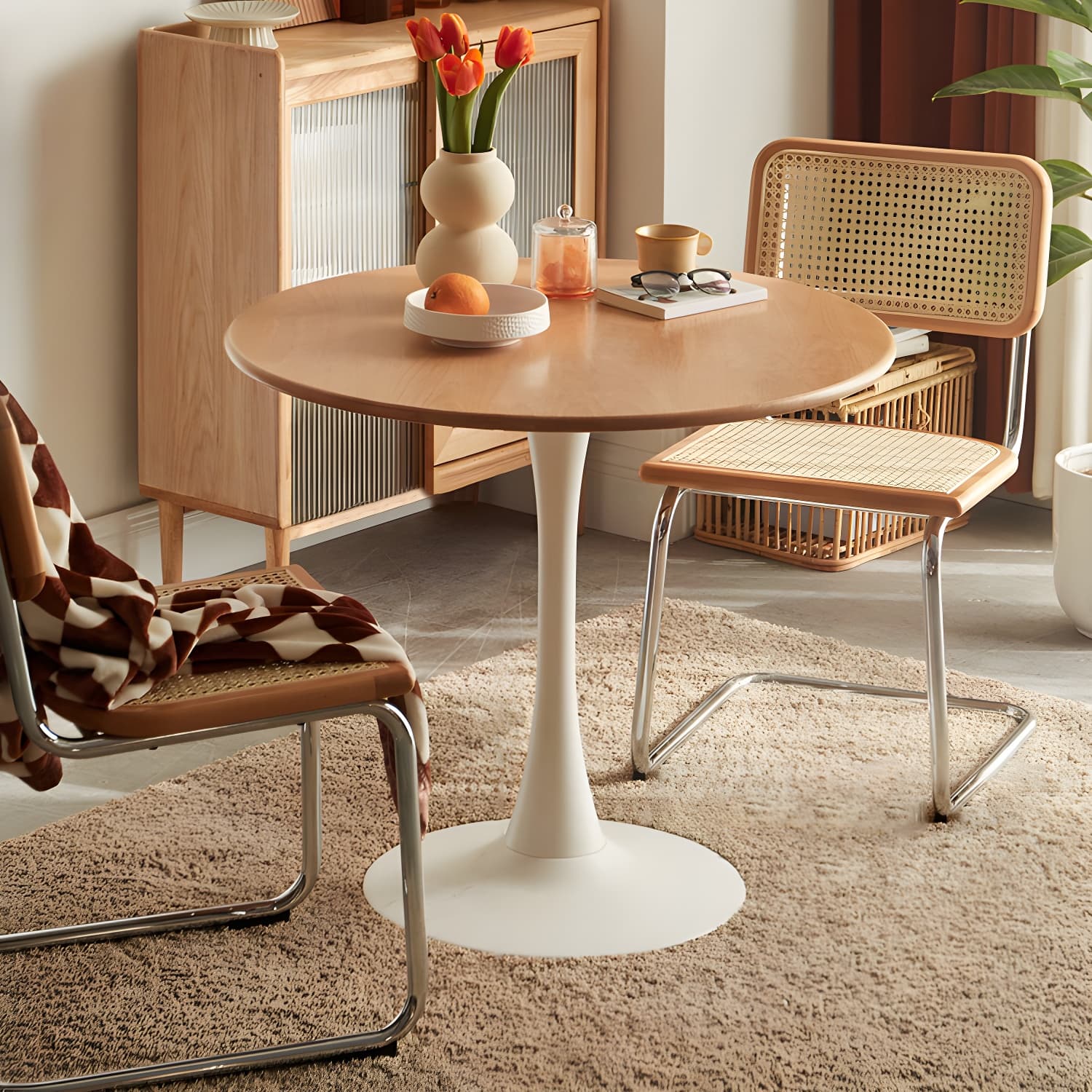 Chic Round Wood Dining Table with Medium Wood Tone and Sleek Steel Tulip Base thumbnail 4