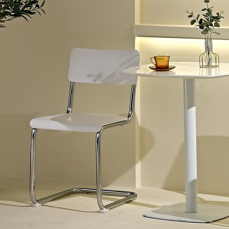 Cantilever Stable Armless Chair with Foot Pads, Open Back and Metal Base in a Modern Style thumbnail 9