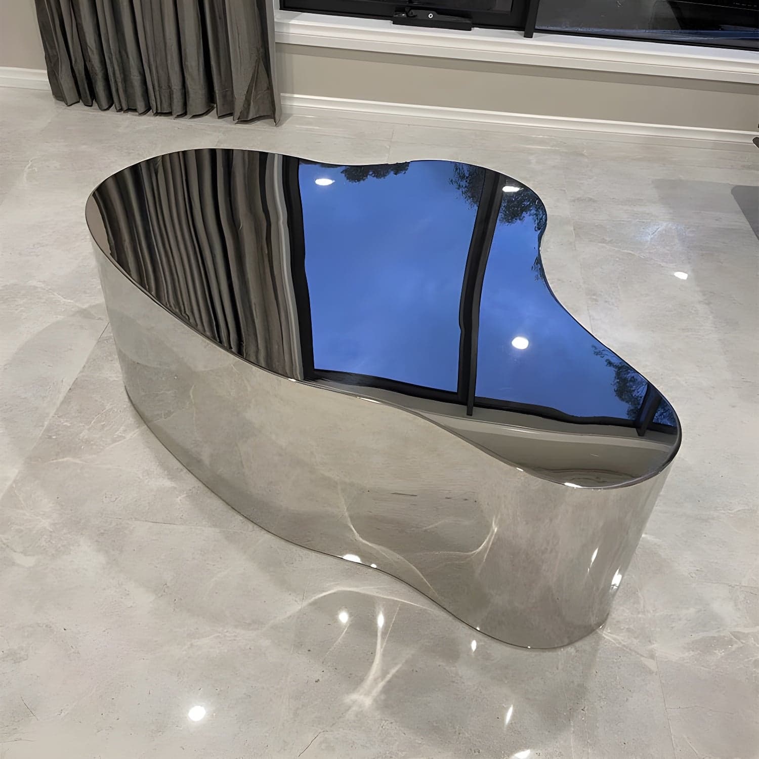 Silver Modern Coffee Table with Free Form Metal Top and Abstract Stainless Steel Base thumbnail 1